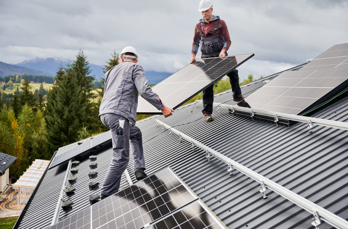 Professional technicians carrying solar PV battery